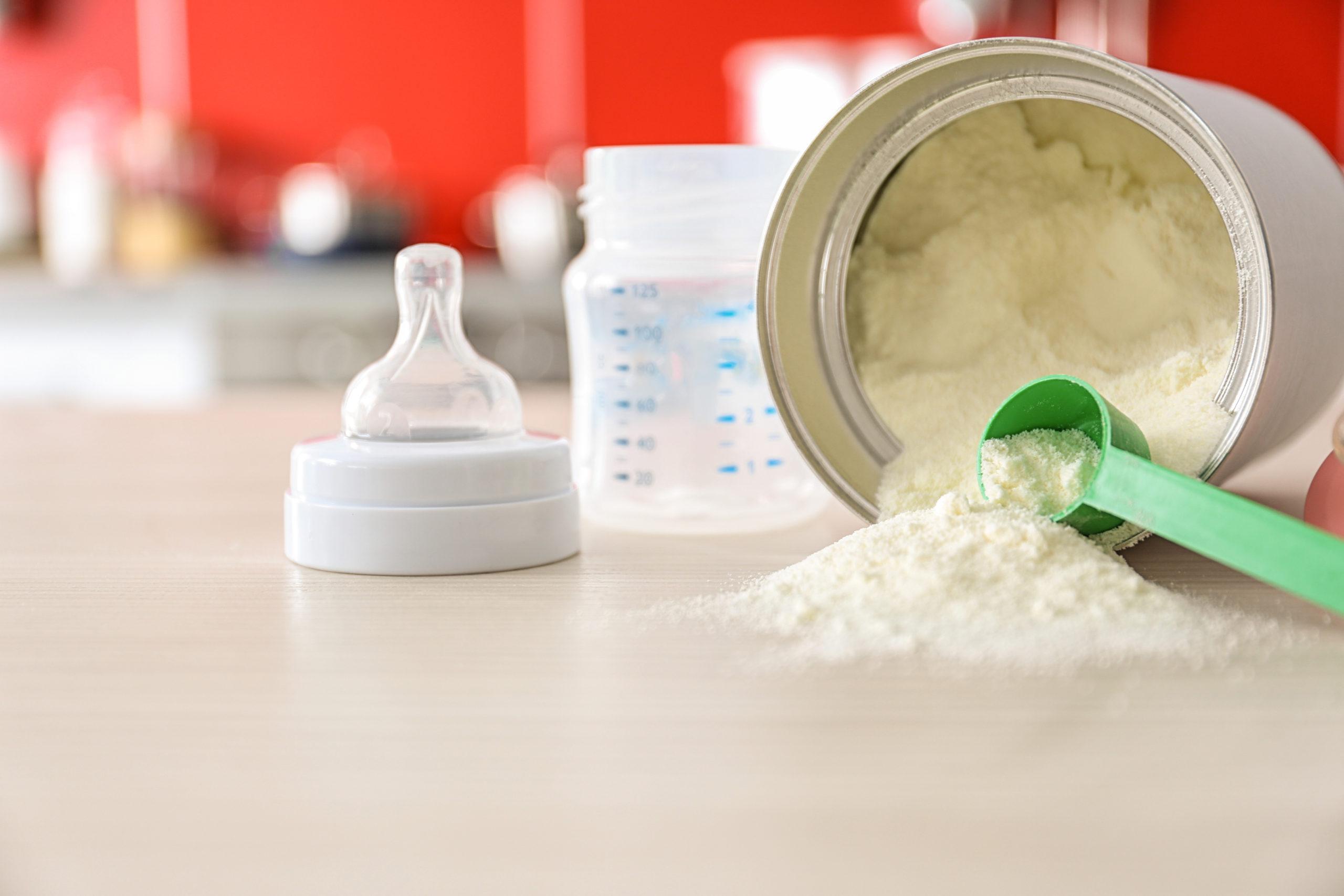 Baby milk formula on kitchen background