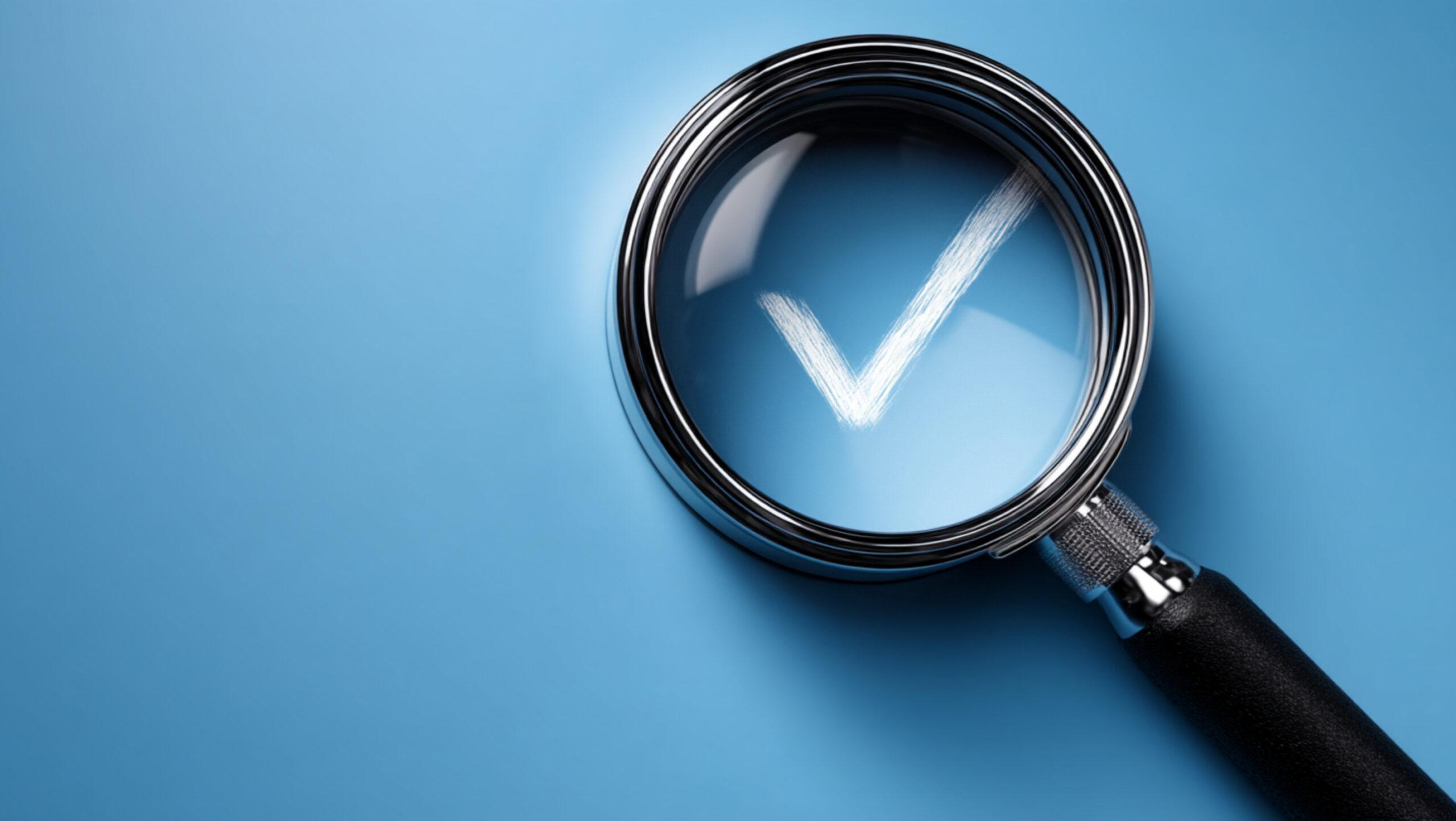 White check symbol magnified on blue background, concept of scrutiny, quality assurance with copy space